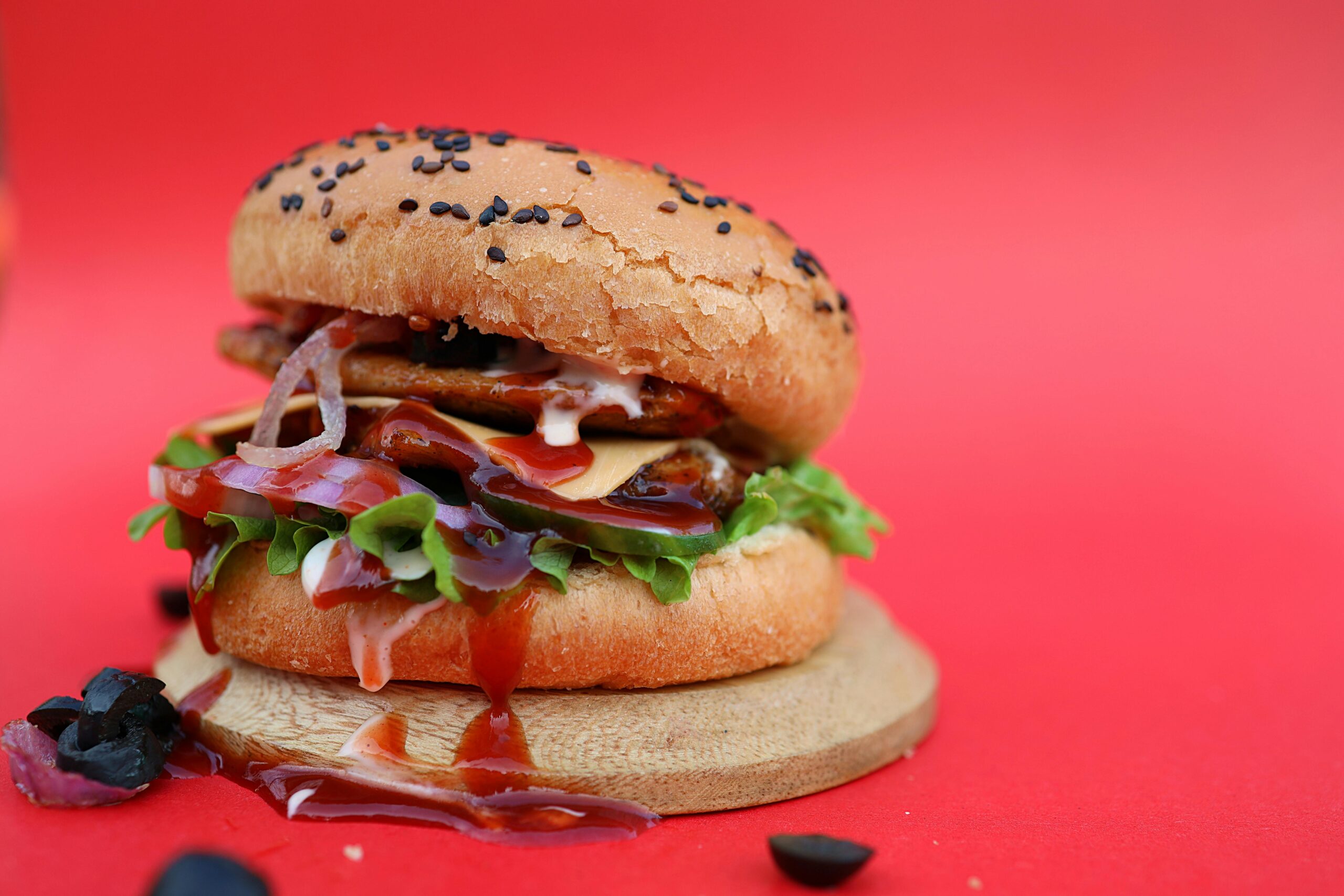 Mouthwatering burger, bun, patties and olives